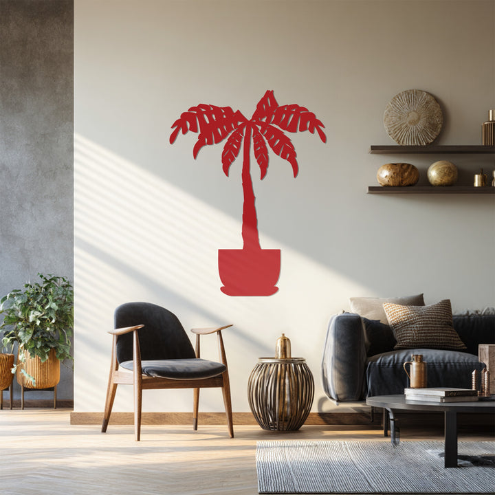 The focal point is the decorative metal art of a tropical palm tree, a modern botanical wall decor adding a touch of nature to the room.