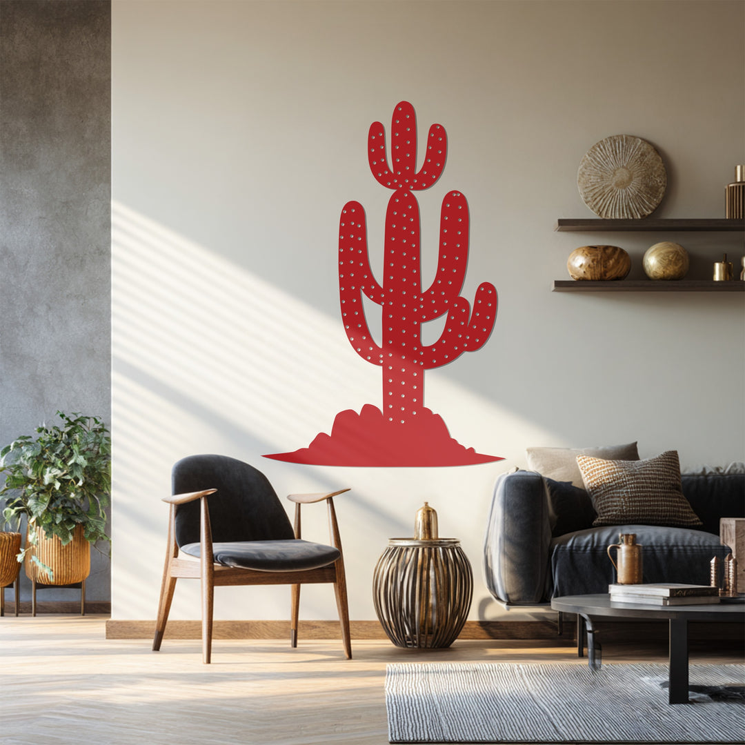 Subtle shadows grace the warm wall around this saguaro cactus metal art for wall, offering a gentle contrast to the sharp, red modern desert landscape.