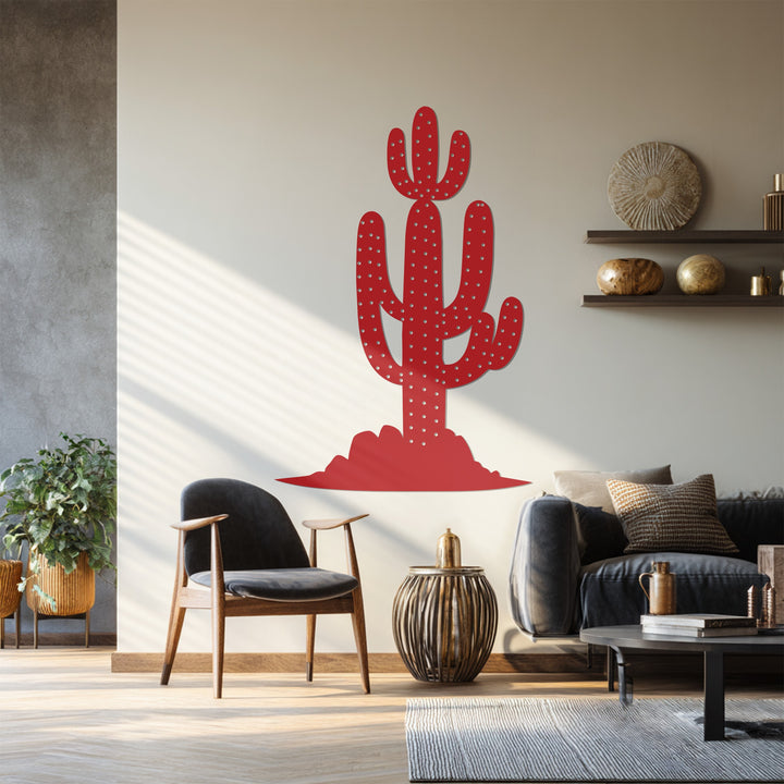 Subtle shadows grace the warm wall around this saguaro cactus metal art for wall, offering a gentle contrast to the sharp, red modern desert landscape.