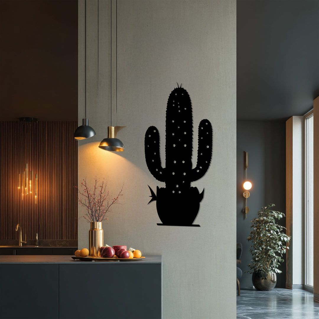 Light and shadow play across the unique metal wall art, showcasing the intricate silhouette of a cactus, a botanical and modern decor piece.