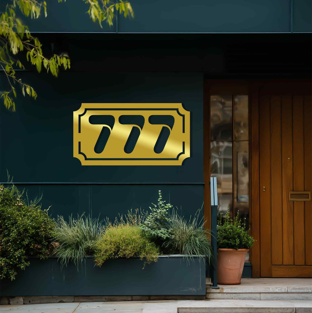 Horizontal metal house number plaque exterior