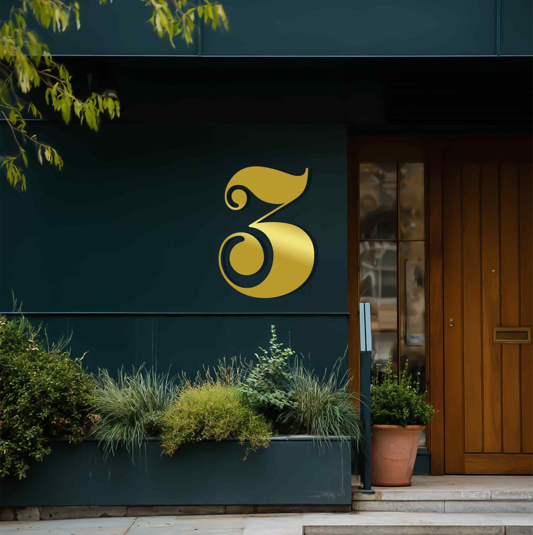 Deep perspective shows a layered view of the building's facade with decorative metal art number three accentuating the entryway's depth.
