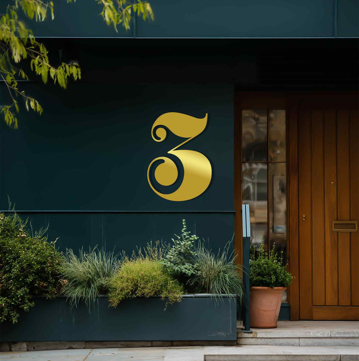 Deep perspective shows a layered view of the building's facade with decorative metal art number three accentuating the entryway's depth.