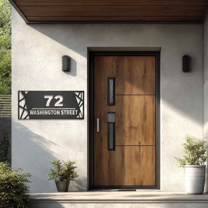 Black metal address plaque with street name