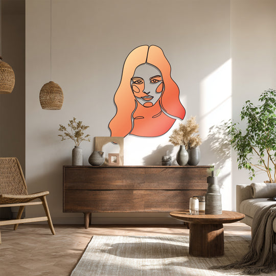 The focal point of this abstract woman line art is the decorative metal art highlighting its minimalist design and modern, warm-toned gradient finish.