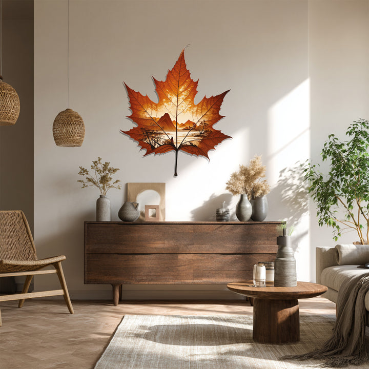 Mounted as the focal point, the decorative metal art of an autumn horizon inside a maple leaf creates a stunning nature landscape wall decor.