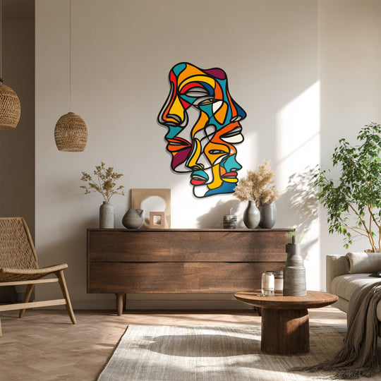 Bold transitions define the metal artwork in this abstract faces wall art, where a spectrum of colors blend to create a modern expressionist design.
