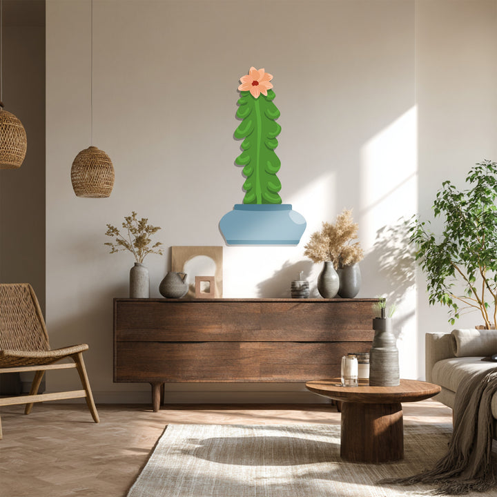 Moderately saturated tones highlight this metal wall decor of a botanical column cactus, bringing a modern, minimal touch to the room's design with its muted vibrancy.
