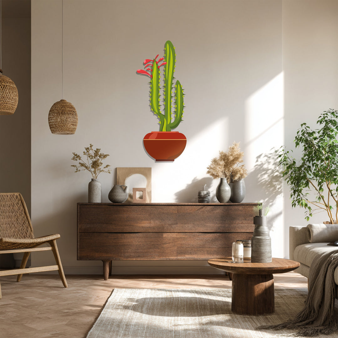 Light and shadow play across the decorative metal art of a twin column cactus, highlighting its modern desert botanical design.