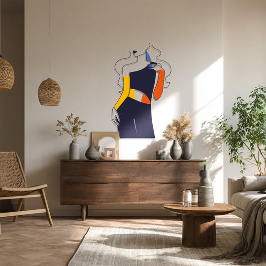 Sunlight casts long shadows on a wall accentuating the bold and minimalist decoration wall art depicting an abstract fashion woman in vivid color blocks.