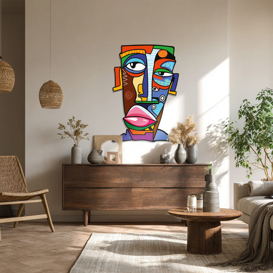 The bold, glossy finish of this unique metal wall art enhances the vibrant colors of the abstract face, adding a modern touch to home decoration.