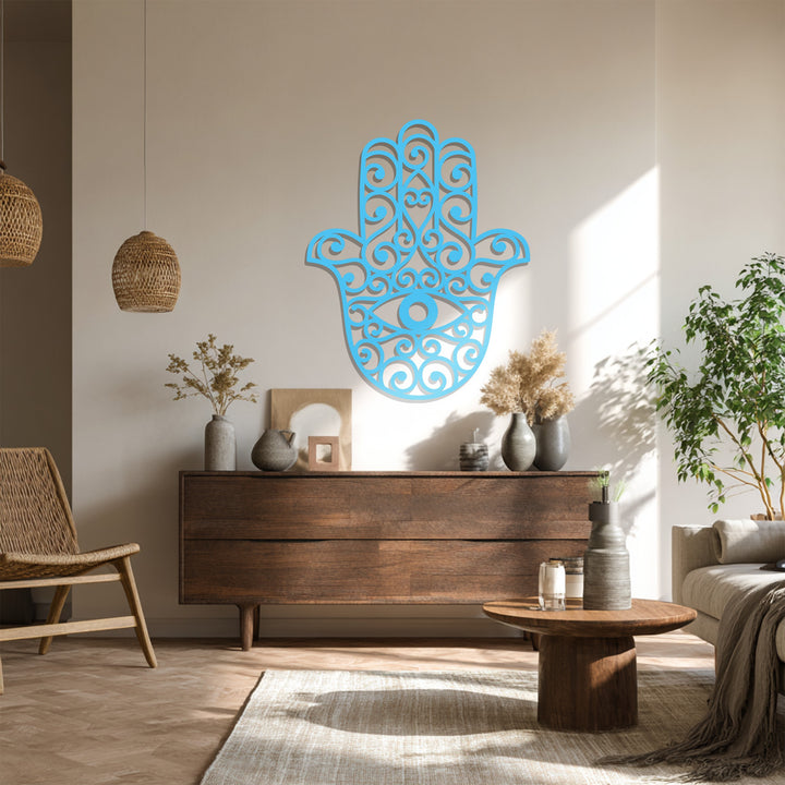 Brilliant blue decoration wall art, a hamsa hand with an evil eye design, boldly claims the focal point in this spiritual wall decor piece.