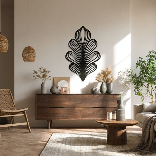 Stillness accentuates the intricate lines of the black leaf metal wall decor, a modern botanical wall sculpture creating a tranquil focal point.