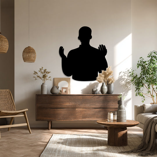 Repeating the silhouette form of the Standing Prayer brings visual rhythm to this decorative metal art, enhancing its symbolic depth and minimalist design.