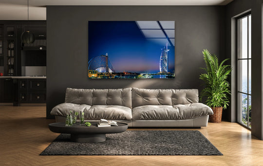 Stillness radiates from this Burj Al Arab nighttime scene reflected on glass, adding serene home decor to a modern living space featuring iconic Dubai landmark.