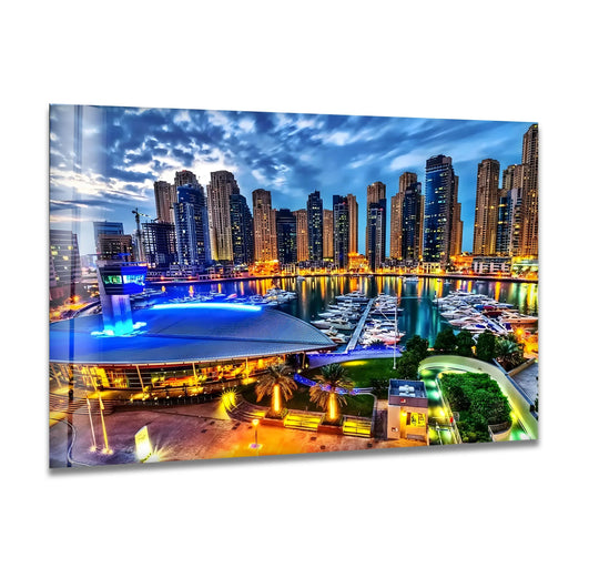 Negative space around Dubai's illuminated skyscrapers and the marina's lights enhances the dramatic depth of this vibrant glass art, capturing a stunning night view.