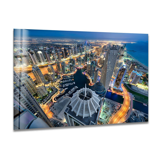 Highly saturated colors illuminate the Dubai Marina cityscape at night in this unique modern wall decor, showcasing an aerial view of the iconic city.