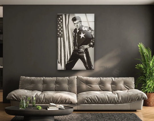 A striking black and white glass wall art piece of Elvis Presley in a leather jumpsuit evokes a rebellious and iconic mood for any space.