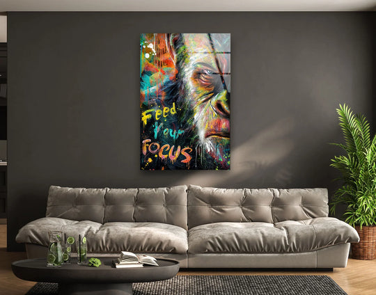 This Feed Your Focus glass wall art features a textured, graffiti-inspired design that adds vibrant flair to home decoration.