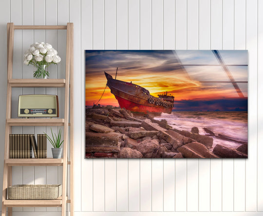 Highlighting the realistic detail, the abandoned ship wall art shows the sun setting over a seascape scene as a dramatic piece of nautical decor with stunning glass printing.