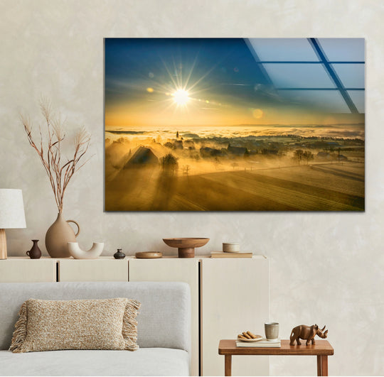 Tempered glass showcases a brilliant, glossy finish, enhancing the serene, golden sunrise and foggy countryside decorative wall art.