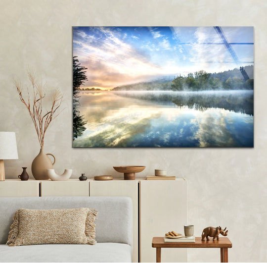 With saturated colors, this misty lake sunrise wall art offers vibrant home decoration, showcasing a tranquil glass landscape print that captures a peaceful morning scene.