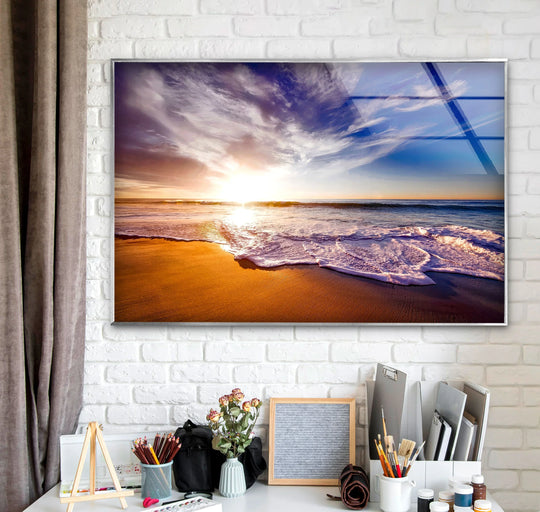 Radiant sunbeams exploding across the sky and reflecting off the ocean dominate this stunning golden horizon landscape tempered glass wall art.