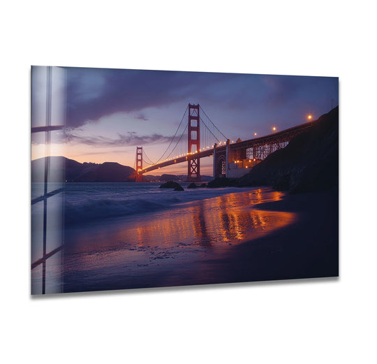 Smooth surface textures define this San Francisco Golden Gate Bridge glass wall art, a captivating example of unique modern wall decor, reflecting a dusky sky in its polished finish.