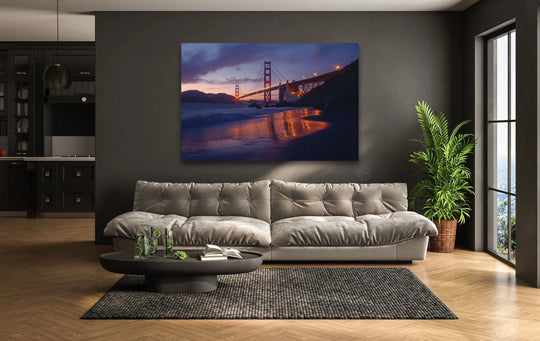 The darkest area of this Golden Gate Bridge at sunset showcases its reflection in the water as a stunning example of glass art painting.