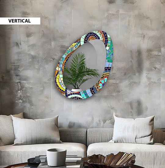 Undulating mosaic tiles give this colorful asymmetric decorative mirror a swirling, dynamic sense of movement.