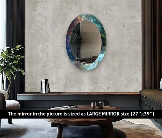A Turquoise Abstract Oval Glass Wall Mirror with a cosmic asymmetric design on a light grey wall