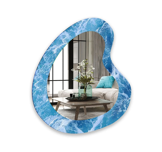 Vibrant blue and white sea waves pattern on this unique asymmetric framed stained glass wall mirror defines the ocean-inspired aesthetic.