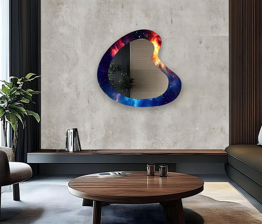 The deepest indigo hues frame the modern mirror, a handcrafted asymmetrical glass wall accent that reflects the room's soft light.