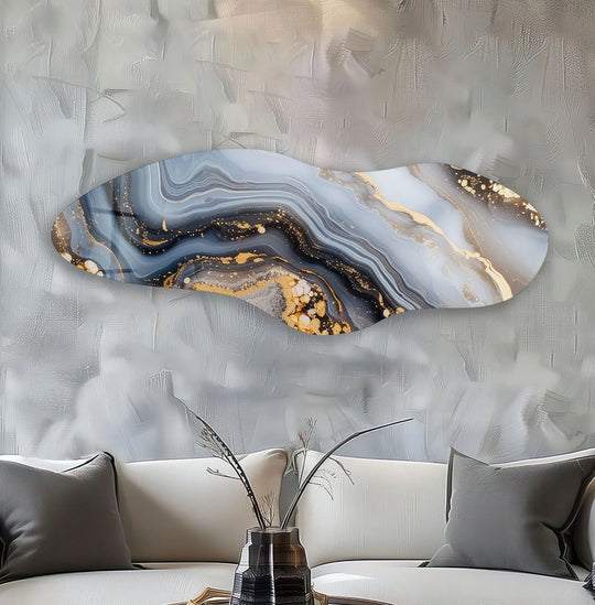 The abstract glass wall art evokes a sense of serene luxury with its flowing navy, white, and gold marbled design.