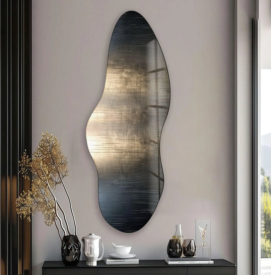 Serene stillness emanates from the irregular asymmetrical silver decorative mirror, reflecting tranquil ambient light.