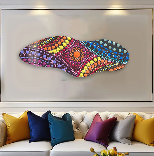 Vibrant pink mosaic irregular glass wall art decor pops with a riot of colorful dots, stealing the scene on a neutral wall.