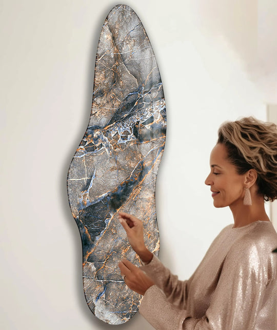 An abstract glass wall artwork showcases organic forms with swirling brown and blue veins resembling a natural stone texture.