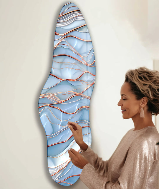 A woman admires the dynamic visual rhythm of this asymmetrical print wall art, featuring flowing abstract waves.