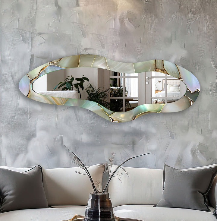 Mirror wall decor combining bold shapes and reflective surfaces to create a striking focal point
