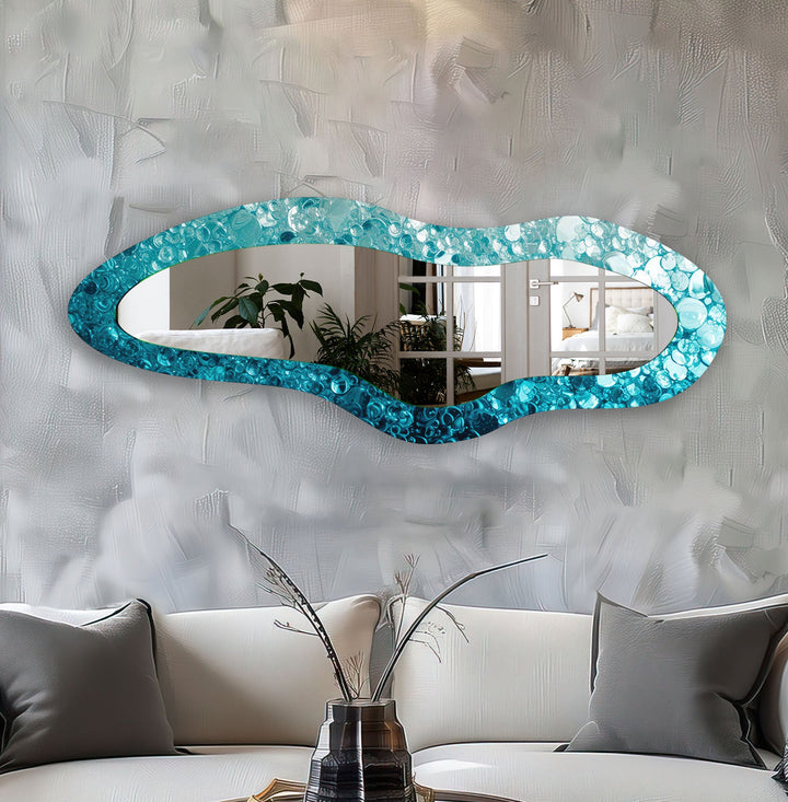 Wall mirrors designed with decorative accents to serve as both art and practicality