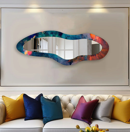 A horizontal glass asymmetric mirror showcasing a blue abstract modern design with a wavy colorful border in blues teals oranges and reds
