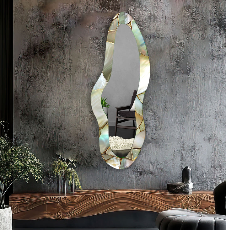 Decorative wall mirror with intricate detailing, perfect for enhancing any interior space
