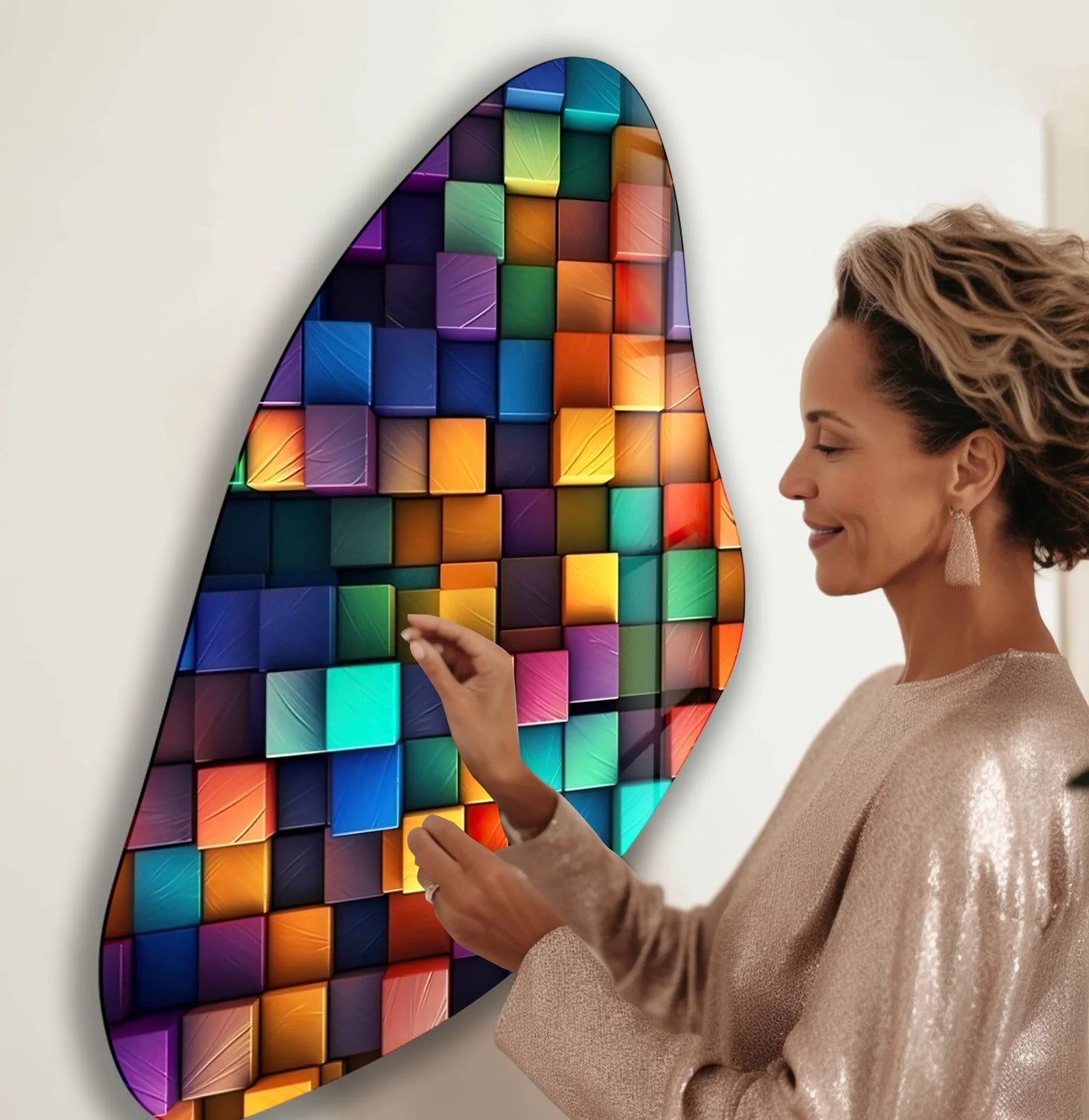 A woman touches a dynamic, abstract glass printing depicting a cascade of colorful blocks that seems to flow across the wall.