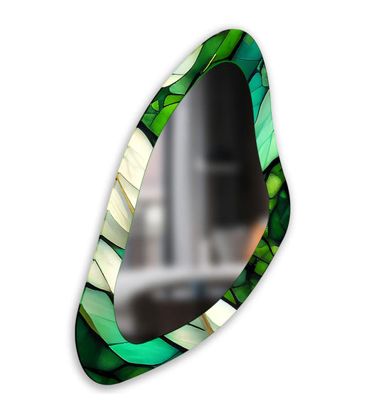 Transitions in the green stained glass wall mirror create a beautiful gradient, enhancing the irregular shape of this distinctive stained glass wall mirror.