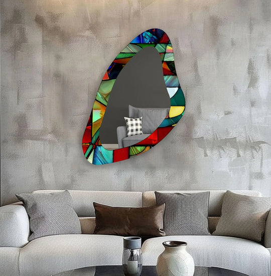 Soft pillowcases are subtly reflecting in the red stained, asymmetric framed wall mirror, creating an illusion of a gallery wall.