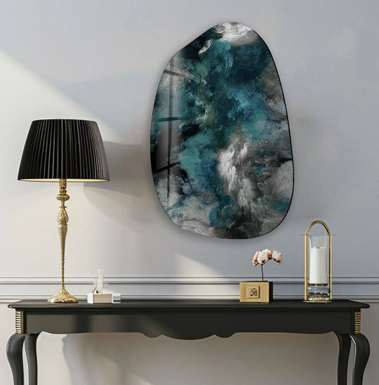 This modern grey abstract irregular glass wall art features a striking transition from deep teal and navy to icy white and charcoal tones.