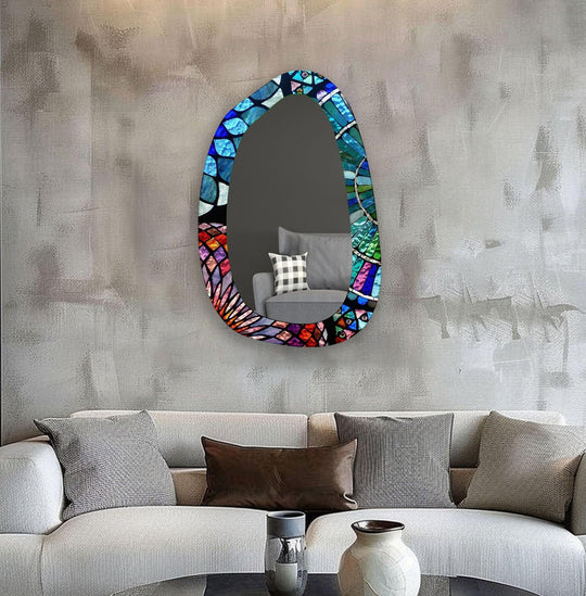 Abundant negative space surrounds this entryway stained glass wall mirror, which features a vibrant blue mosaic design, making a modern statement with reflected light.