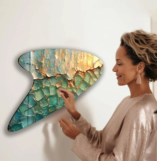 Golden light illuminates cracks in a striking abstract glass art mosaic of shimmering green and gold hues.