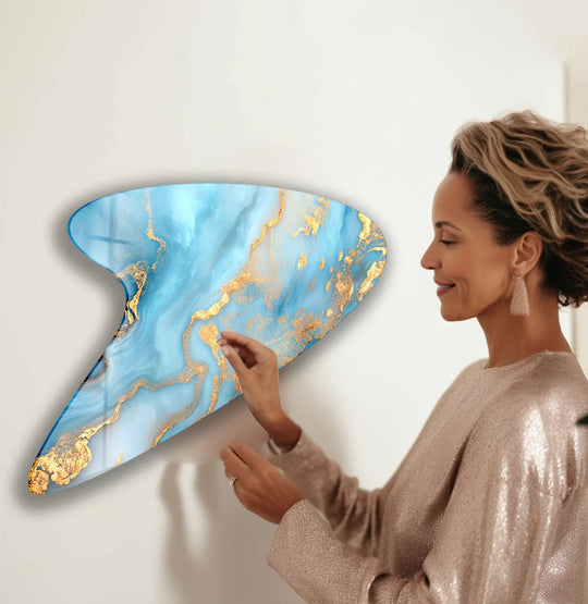 Vibrant azure and gold hues saturate this abstract irregular glass hanging wall art, creating a stunning marble effect.
