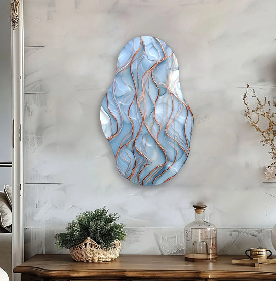 Organic forms in blue abstract glass art swirl with delicate gold accents, creating a fluid, flowing composition.